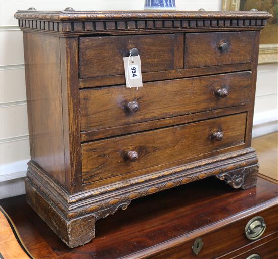 A North Italian walnut small chest of drawers W.65cm